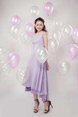 Asian pretty fashionable woman with pastel balloons