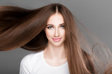  woman with shiny straight long hair. 