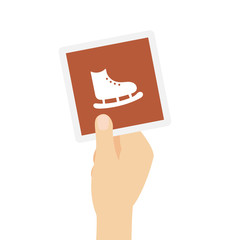 Hand h&auml;lt Karte - Schlittschuhe