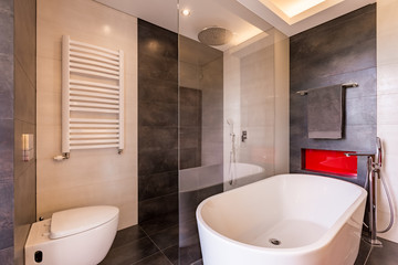 Fototapeta na wymiar Bathroom with bathtub and shower