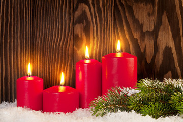 Christmas candles and snow fir tree