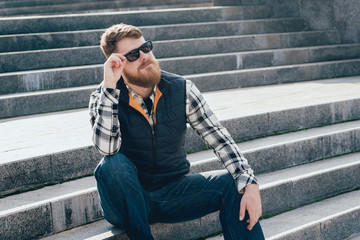 Fototapeta premium Handsome bearded man in casual clothes posing on camera