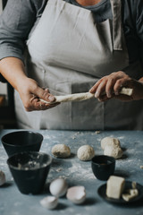 Woman working with dough  