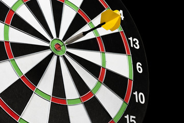game of darts on a black background isolation