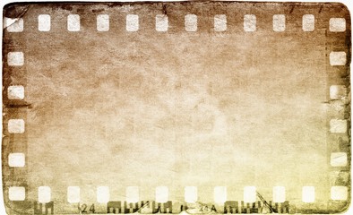 Vintage film strip frame on old and damaged paper background.