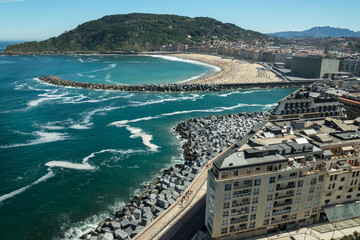 Donostia / San Sebastian city in Spain during the summer day with beaches, ocean and mountains. Top view.
