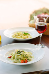 Italian food - fettuccine pasta with spinach and seafood.