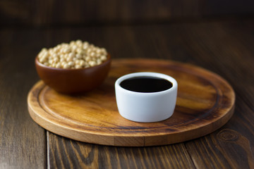 Beautiful soy sauce in a white ceramic bowl