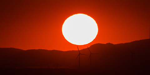 Wind turbines during sunset