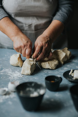 Woman working with dough 