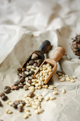 Cedar nuts on wooden spoons.