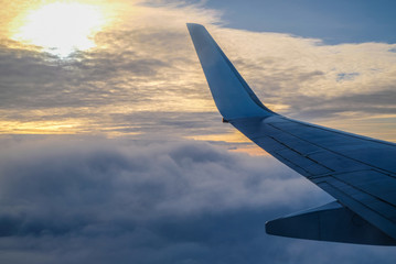 plane wing and sun set sky