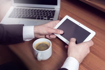 hands businessman on a tablet