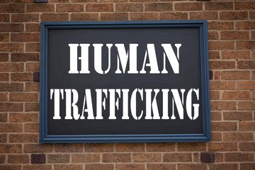 Fototapeta na wymiar Conceptual hand writing text caption inspiration showing announcement Human Trafficking. Business concept for Slavery Crime Prevention written on frame old brick background copy space