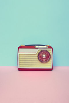 Vintage old radio on pastel background with space for copy.