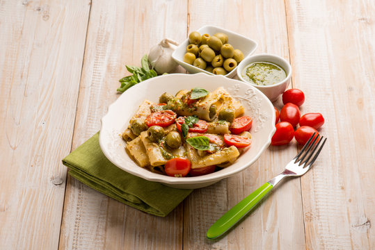 paccheri with pesto fresh tomatoes and parmesan cheese