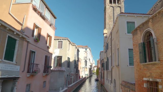 14785_Surrounding_the_canal_are_tall_buildings_in_Italy.mov