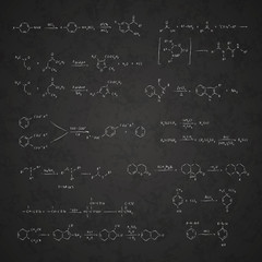 Set of chemical reaction equations and formulas on school blackboard
