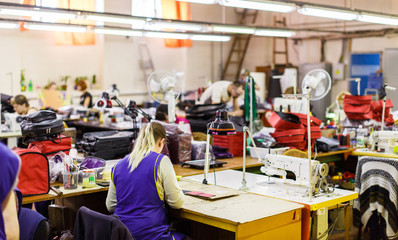 people manufacturing bags