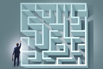 Businessman is trying to escape from maze labyrinth