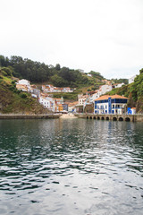 View from water to Cudillero, small fishing village in Asturias, Spain. 