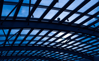 Glass Roof Against Blue Sky And Sun Shine