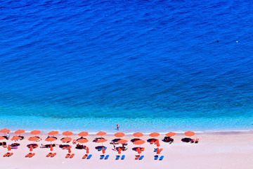 people sunbathing on a paradise Apella beach
