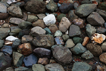 wet large stones of different colors, close-up