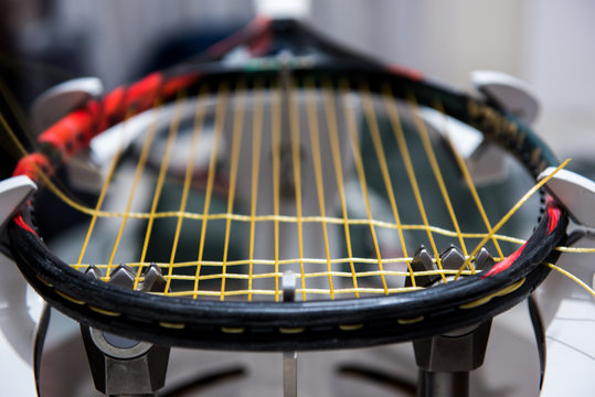 Stringing Tennis Racquet On Professional Electrical Stringing Machine