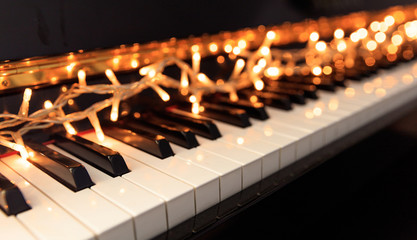 Christmas lights on a piano keyboard