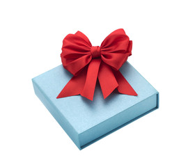 Festive Christmas box with a red bow on a white background