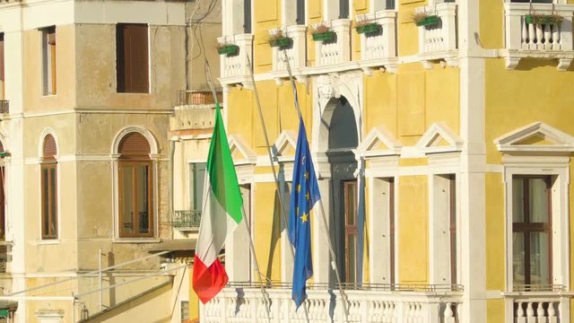 14774_The_European_Union_and_Italy_flag_on_the_window_veranda_in_Italy.mov