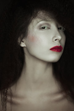 Arty make-up concept. Close up portrait of a vintage a-la french princess portrait of a young beautiful girl. Studio shot.