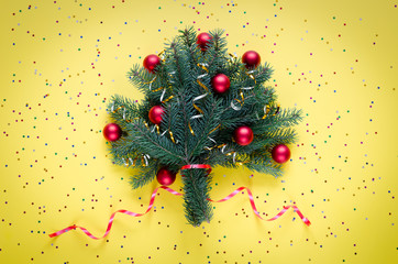 Festive Christmas bouquet of spruce, decorated with Christmas toys and ribbons