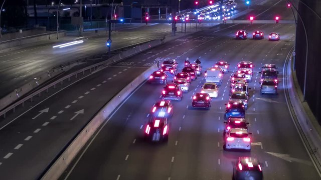 Scene of traffic at dusk in a main street of entry and exit of Barcelona. Fast double zoom , out and in. Hyper lapse.Trail effect.
Logos, car registrations, etc. are manually blurred frame by frame.