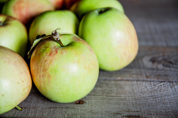 Ripe red apples on wooden background