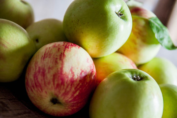 Ripe red apples on wooden background