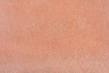 Fototapeta premium Texture of a gravel path of orange color (background)