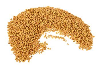 Pile of fenugreek seeds isolated on white background