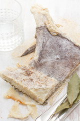 dry salted cod fish on wooden background