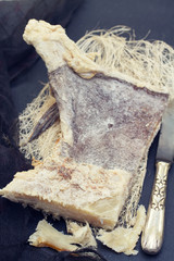 dry salted cod fish on wooden background