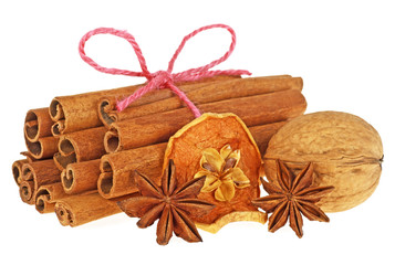 Christmas spices - cinnamon sticks, anise stars, dried apple and walnut