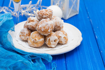 portuguese sweets cavacas on white plate on wooden background