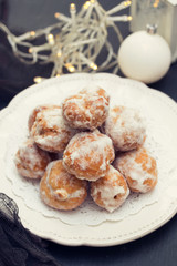 portuguese sweets on white plate on wooden background