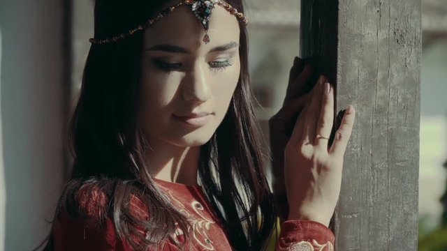 Portrait of Smiling Beautiful Muslim Girl. Traditional Red Tatar Costume