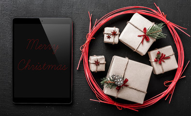 Congratulation for winter holidays, black ipad to write a message for your loved ones, winter symbol of winter holidays