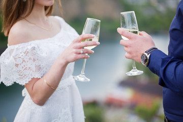 happy loving couple holding glasses of champagne