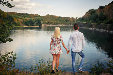 loving couple walking near the lake