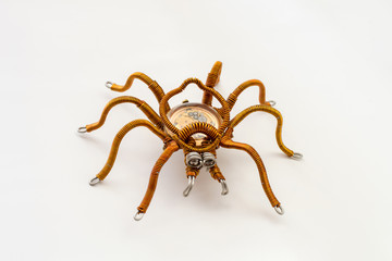 Metal spider with built-in clockwork on white background, steampunk style