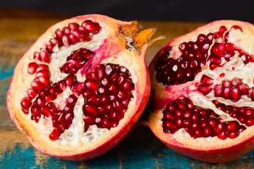 Healthy fruit red ripe pomegranate, rich of Vitamin C, also known as a symbol of prosperity, fertility and used in traditional medicine